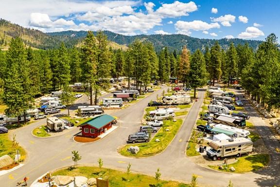 Aerial view of a full-service RV park in Washington state with multiple campsites, hookups, and roads, ideal for family RV camping and long-term stays