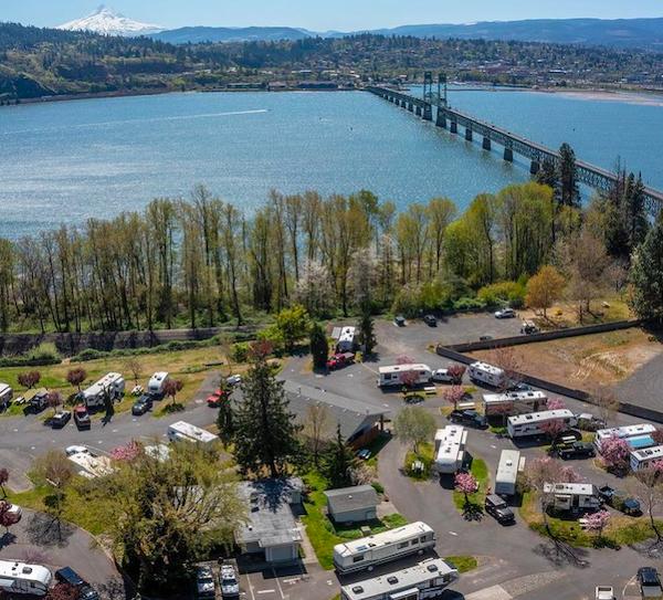 Aerial view of an RV park along the Columbia River in Washington with bridge access and waterfront campsites near the Gorge