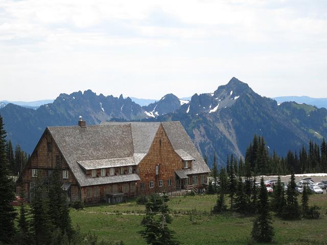 Historic Paradise Inn lodge surrounded by mountain peaks near Mount Rainier National Park in Washington State.