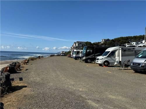 Beachfront RV campground with motorhomes lined along the Washington coast, highlighting oceanfront camping and top Puget Sound RV parks for Summer 2026 travel and camping vacations.