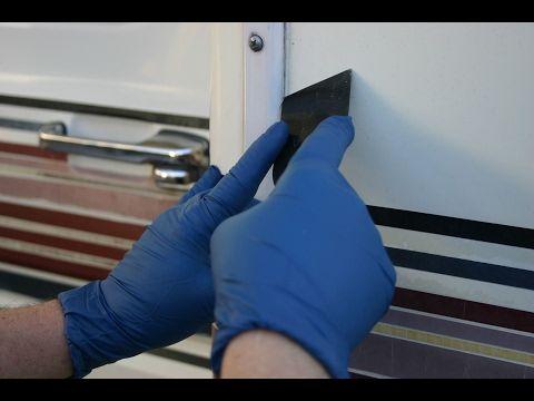 Inspecting RV exterior seals and caulking during a spring RV maintenance checklist before PNW camping season.