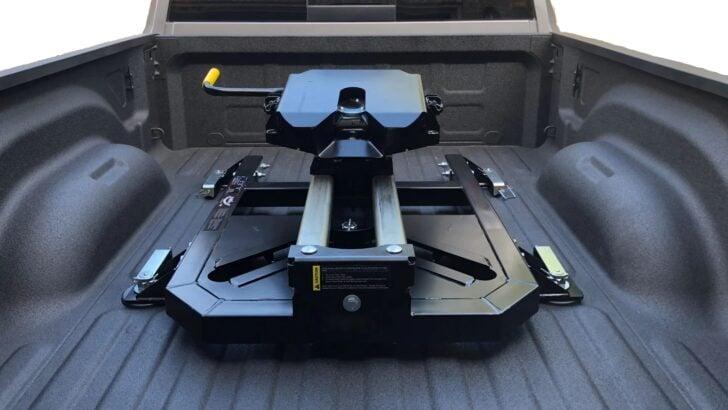 Fifth wheel hitch installed in a pickup truck bed for safe heavy-duty RV towing and towing capacity support.